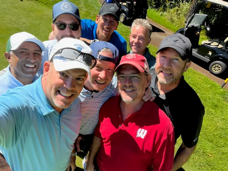 A group gathered together on the course