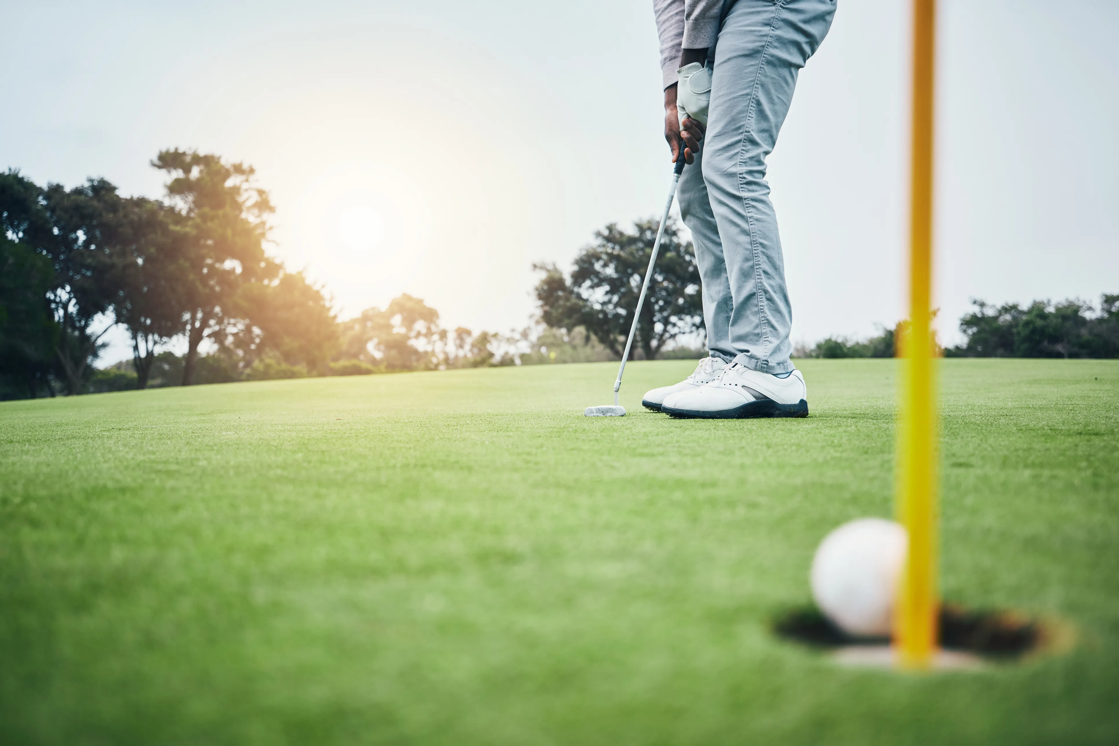 A player putting on the green