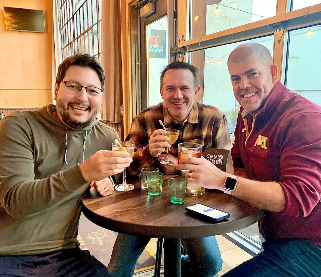 The group raising a toast together after a round
